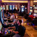 Players celebrating wins at colorful slot machines, showcasing a dynamic atmosphere in du 88 casino.