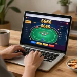 Play online poker on S666 with a cozy home setup, featuring a laptop and snacks.